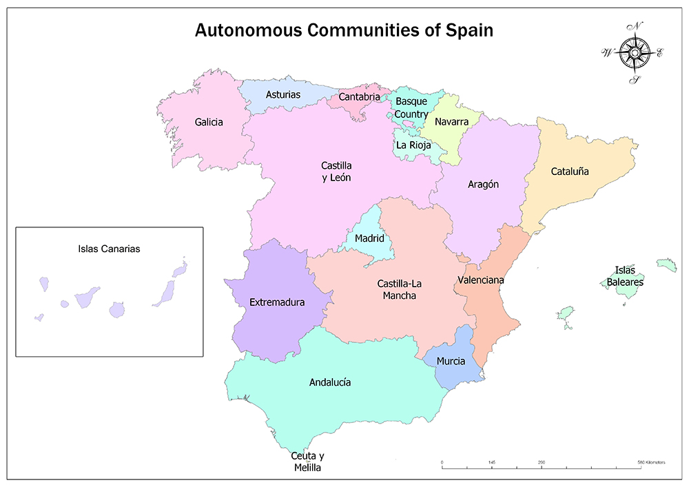 A color-coded map of Spain's Autonomous Communities, each labeled and uniquely colored. Includes Canary Islands inset and compass rose.