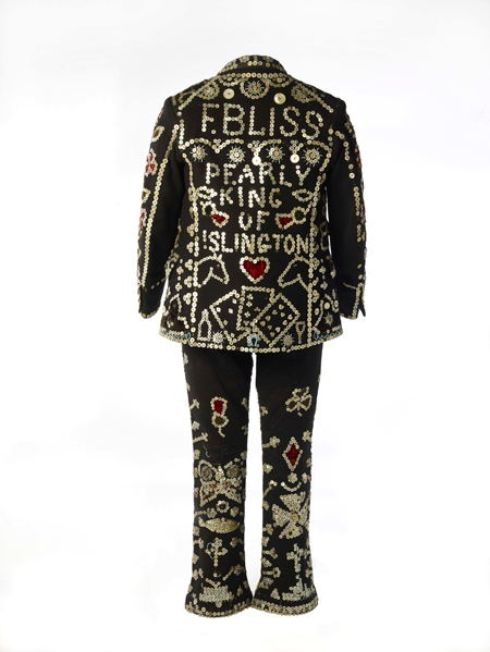 A black suit with intricate white and red beadwork, including text and symbols, displayed against a white background.