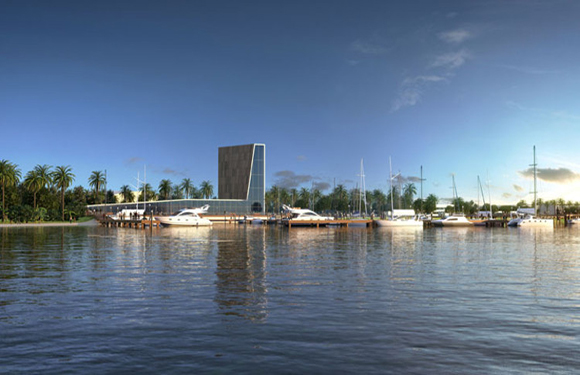 A serene waterfront scene with a drawbridge raised in the distance, boats docked along the shore, and a clear blue sky with scattered clouds.