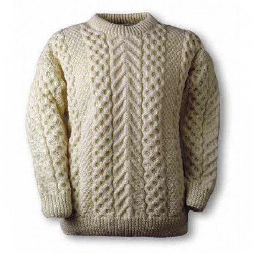 A cream-colored cable knit sweater displayed against a plain background.