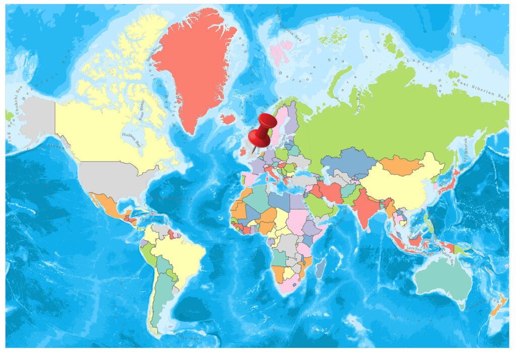 A colorful political map of the world showing countries in different colors with blue oceans surrounding the landmasses.