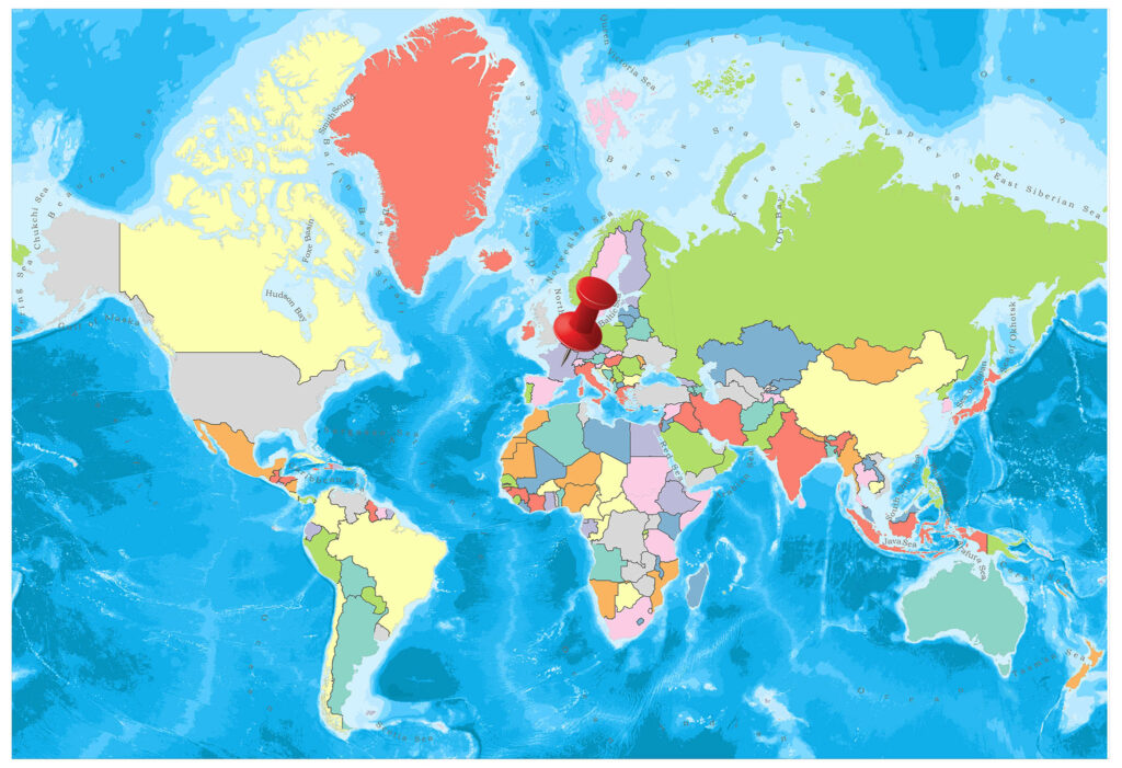 A colorful world map with countries in various shades of red, green, yellow, and blue, against a background of blue oceans.