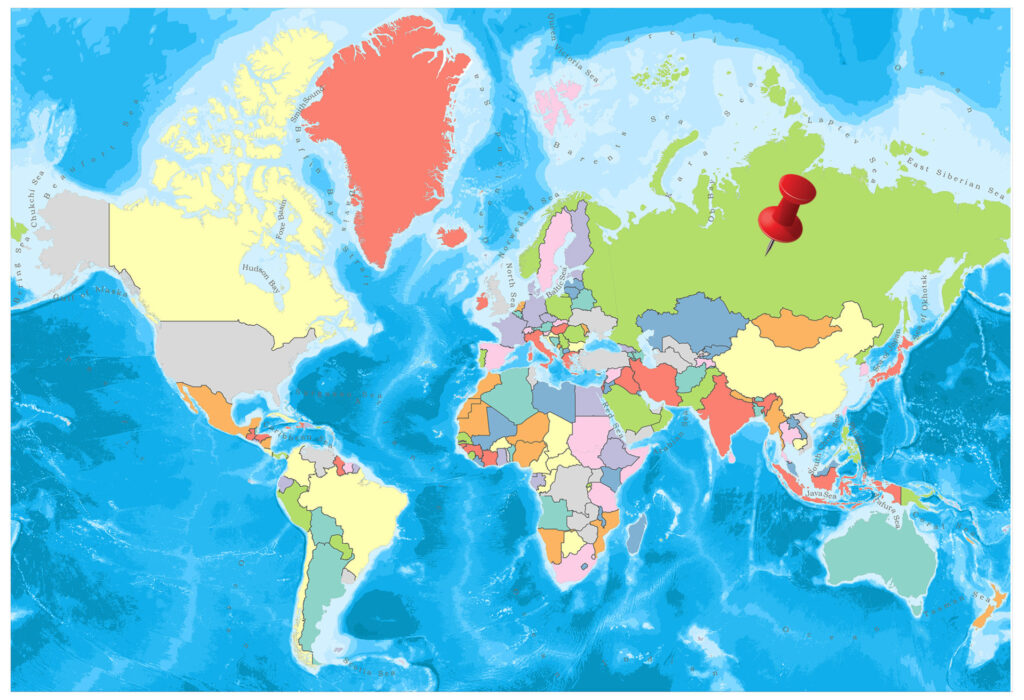 A colorful world map with countries in different colors and a few red pin markers over central Europe.