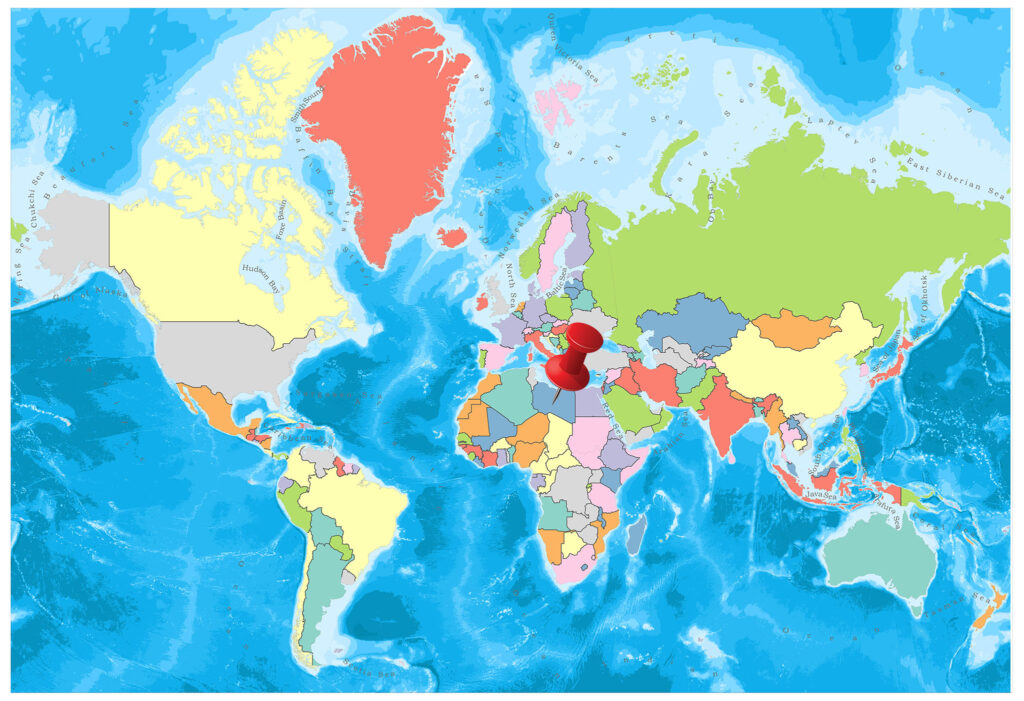 A colorful political map of the world with countries marked in different colors and oceans in blue.