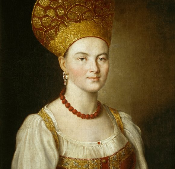 A painting depicts a woman in a golden Russian kokoshnik and white blouse with red jewelry, against a dark background.