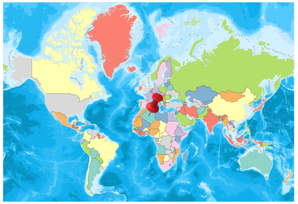 A colorful world map with countries marked in different colors and the oceans in light blue.