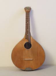 A traditional wooden stringed instrument with a pear-shaped body, a long neck, and a circular sound hole, displayed against a plain background.