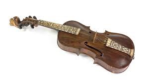 An old violin with intricate inlay work on a white background.