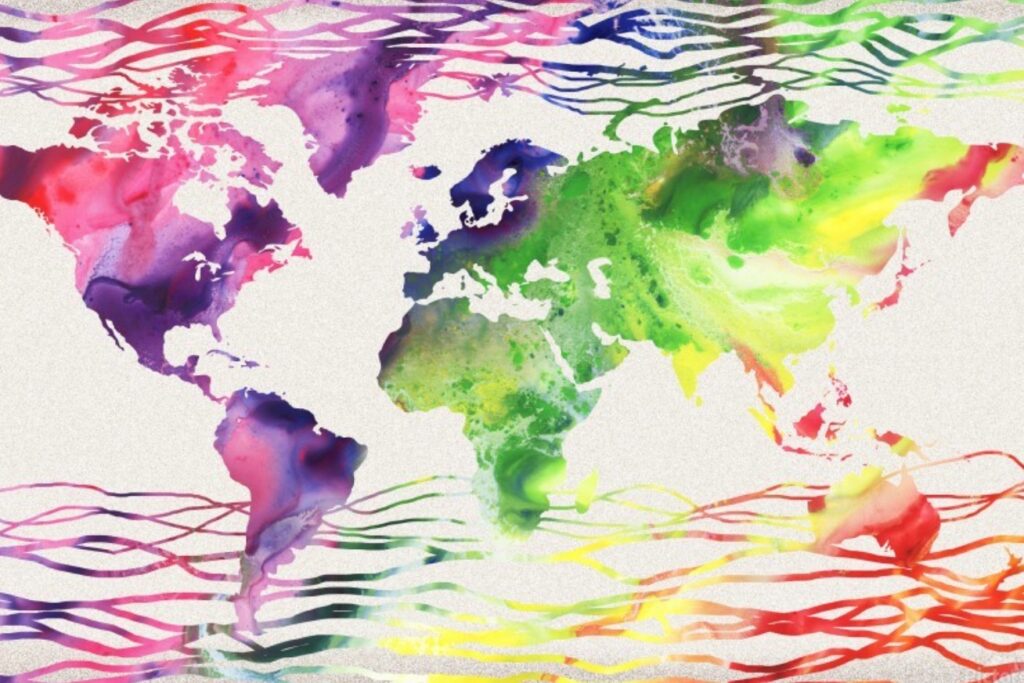 A colorful watercolor painting of a world map, with abstract splashes and strokes representing the continents.