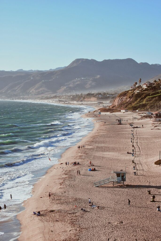 Top 10 Longest Coastline Countries 2 People at a beach in Malibu, California.