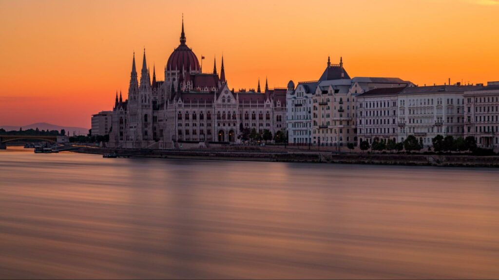 A view of the Danube River as it passes through Budapest at sunset.