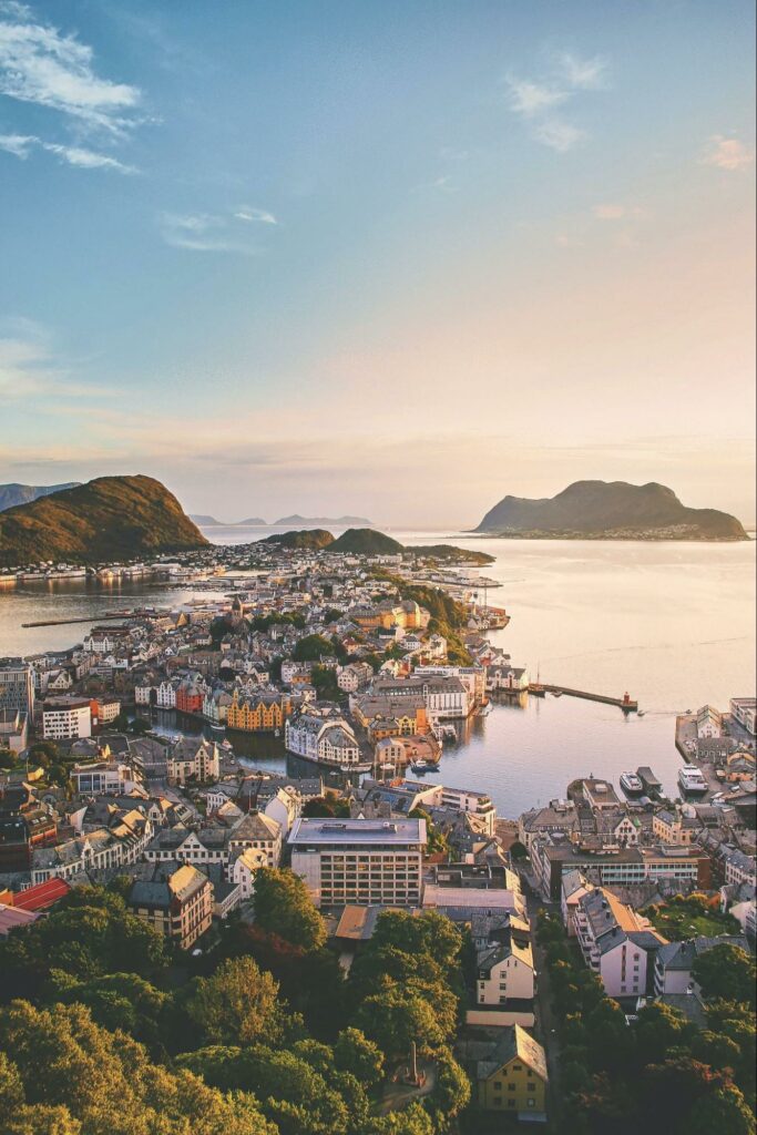 A view of buildings along the water in Alesund, Norway.