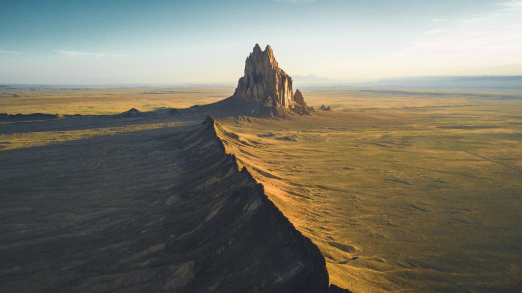 An aerial view of Shiprock in New Mexico and the surrounding desert.