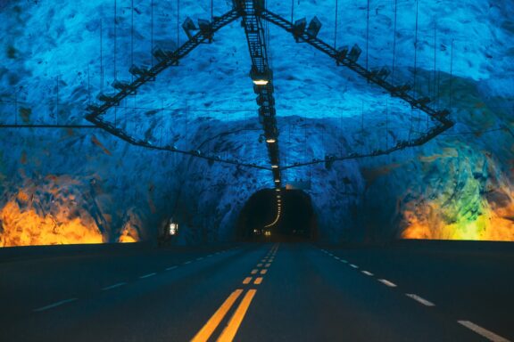 Lærdal tunnel, Norway. Road on illuminated tunnel in Norwegian mountains. The longest road tunnel in the world.