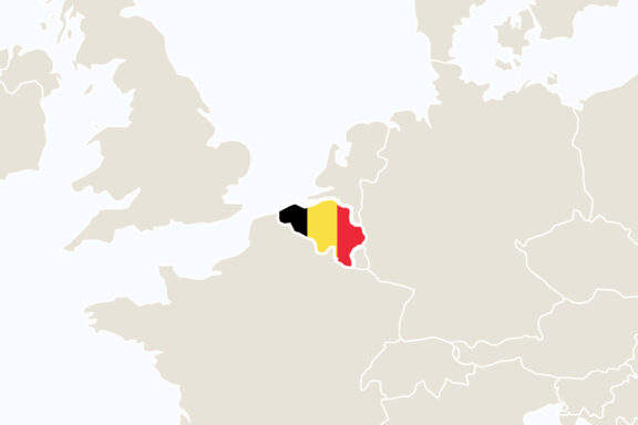 A map highlighting Belgium in red on a simplified map of Europe, with surrounding countries in a muted beige color.