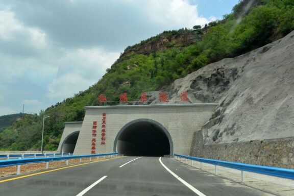 A road leading to a tunnel entrance through the Taihang Mountains.