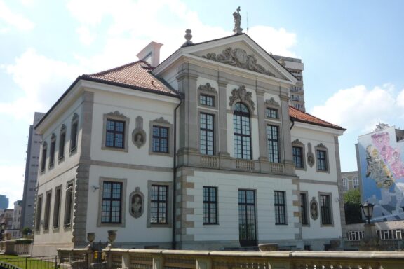 The Chopin Museum in Warsaw is a classic European-style building with a decorative facade and large windows.