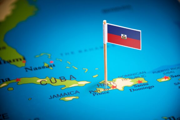 Haiti's location at the Carribean marked by a pin of its national flag