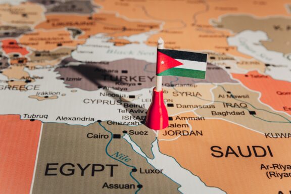 Jordan's location in the middle east, marked by a pin of its national flag