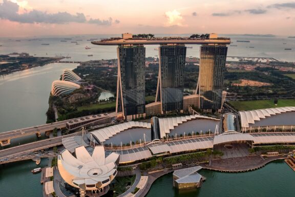 Aerial view of Marina Bay Sands hotel during sunset in Singapore.