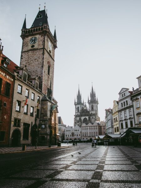 Old Town Square in Prague features cobblestone streets, the Gothic Church of Our Lady before Týn, and the Old Town Hall Tower.