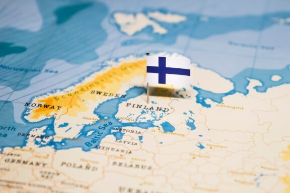 Finland's location in Northern Europe marked by a flag pin of its national flag