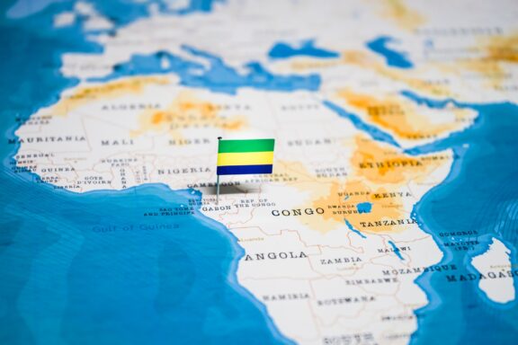 A flag pin symbolizing Gabon placed on its location in Central Africa