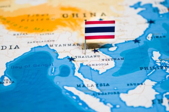 Thailand's location marked by a pin of its national flag