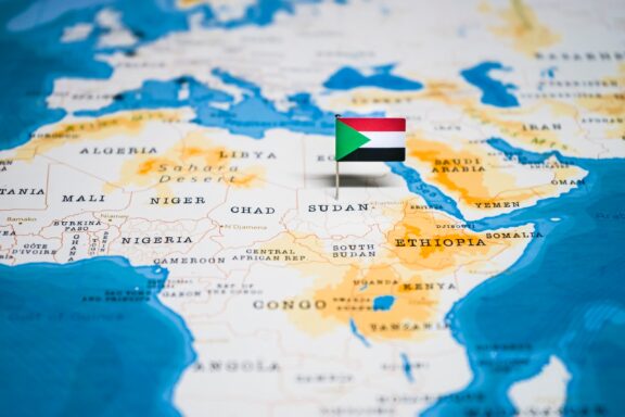 Map of Africa with a Flag Pin on Sudan Flag pinned location of Khartoum, the capital city of Sudan
