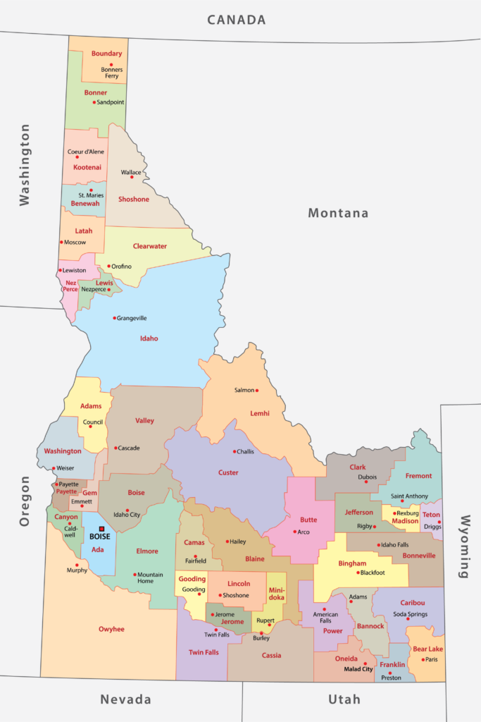 A colored map of Idaho's counties, also featuring parts of neighboring states and Canada.