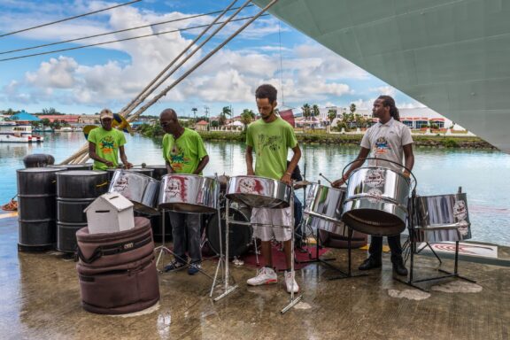 A steel drum band performing by the waterfront in St. John's, Antigua and Barbuda.