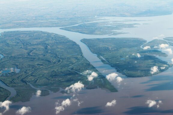 Aerial view from an airplane at the mouth of the Paraná Delta in the Río de la Plata, Buenos Aires, Argentina.