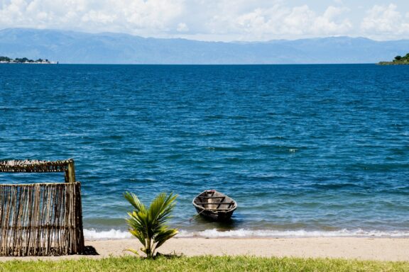 Lonely Boat next to a Shed on the Beach, Lake Tanganyika, Tanzania, Africa.