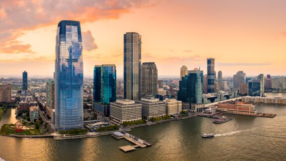 Aerial panorama of jersey city skyline at sunset