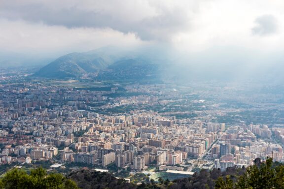 Aerial view of Palermo city, Sicily, Italy. Airport Boccadifalco on the background. Picturesque view from Mount Pellegrino.