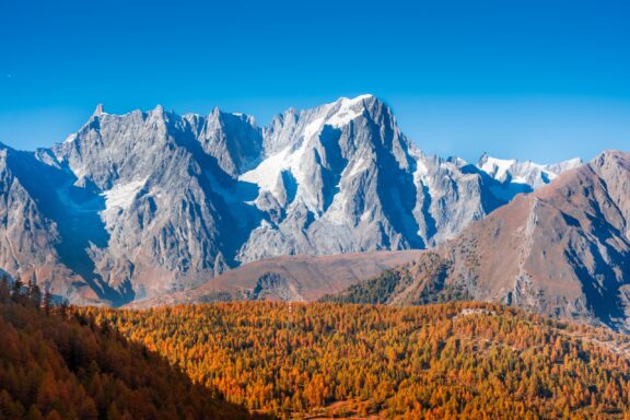 Monte Rosa towers above a beautiful autumnal landscape in Northwestern Italy