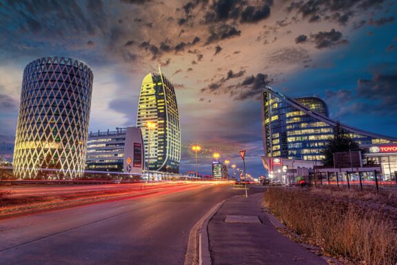 Twilight Cityscape with Modern Buildings and Street Lights Capital Fort Business Center in Sofia