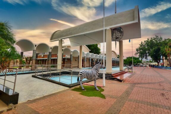 National Assembly Building in Gaborone, Botswana with Zebra Statue Entrance to the National Assembly building which houses the Parliament of Botswana