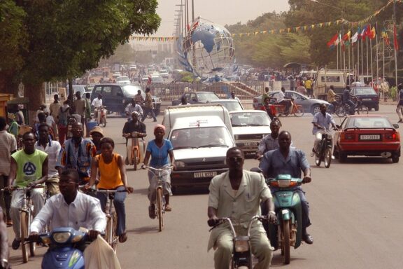 Ouagadougou locals commuting through the city center