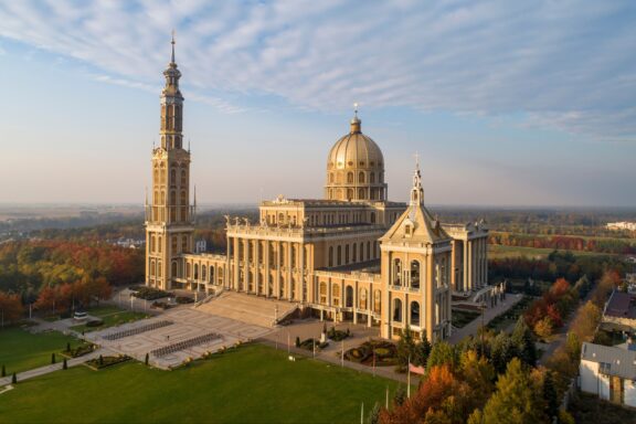 Sanctuary and Basilica of Our Lady of Licheń in small village Lichen. The biggest church in Poland, one of the largest in the World. Famous Catholic pilgrimage site. Aerial view in fall