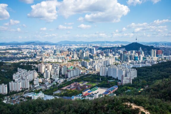 Seodaemun-gu, Seoul, South Korea - September 27, 2020: Aerial view of Seodaemun Prison of Seodaemun Independent Park and highrise apartments with the background of downtown Seoul and N Seoul Tower