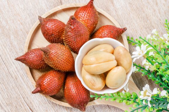 Salak palm waive or snake fruit in wooden dish