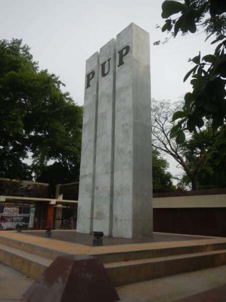 Pylons of the Polytechnic University of the Philippines displaying the letters "PUP."