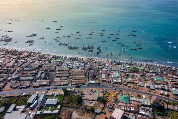 Aerial view of fishing village of Tanji. Unloading of fishing boats. The Gambia. West Africa.