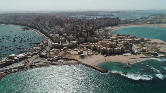 Aerial View of Coastal Cityscape in Alexandria, Egypt Aerial drone shot over egypt alexandria city sea