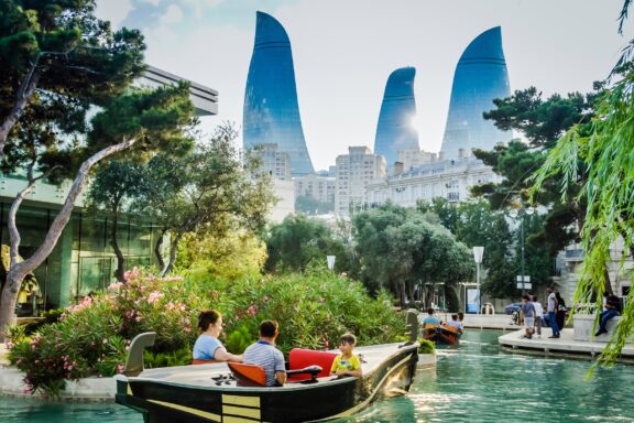 A family boats down a river in Baku, Azerbaijan.