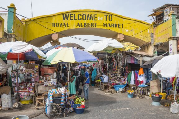 Vibrant Market Scene at the Entrance of Royal Albert Market in Banjul, Gambia The entrance to the Royal Albert Market can be seen in Banjul, the capital of The Gambia.