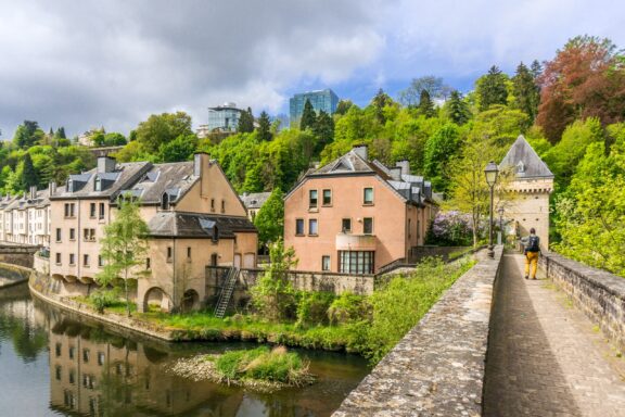 Beautiful buildings line a canal in the Pfaffenthal quarter of Luxembourg City. 