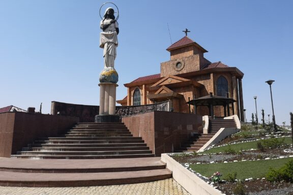 Statue and Church on Bioko Island Church on Bioko Island, Equatorial Guinea