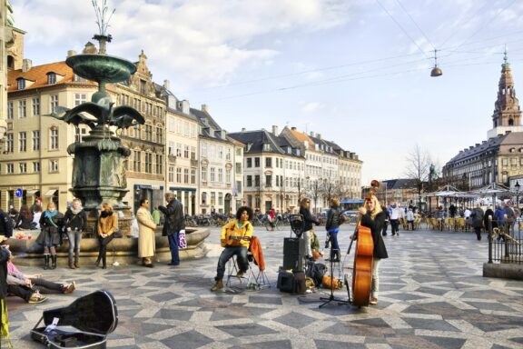 Musicians gather near the Stork Fountain in the center of Copenhagen, Denmark. 